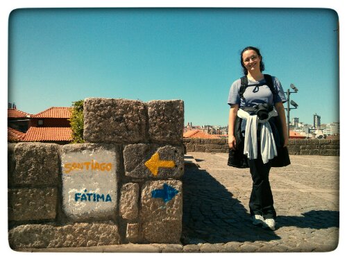 Fatima in front of the signs showing both ways